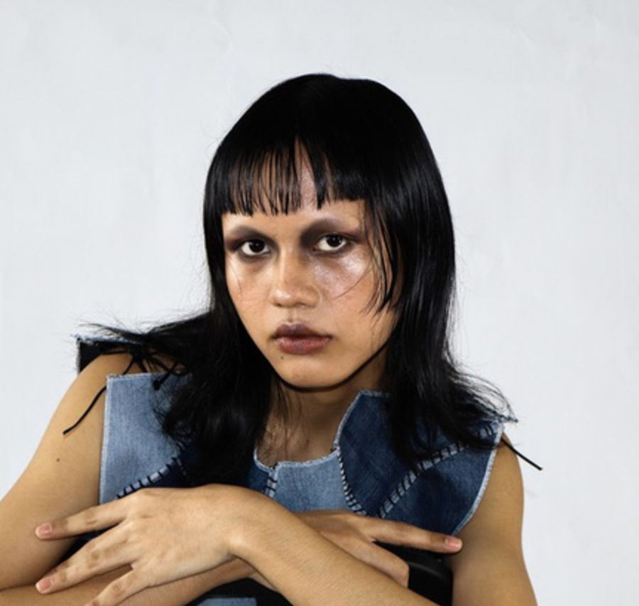Portrait in a patchwork denim vest