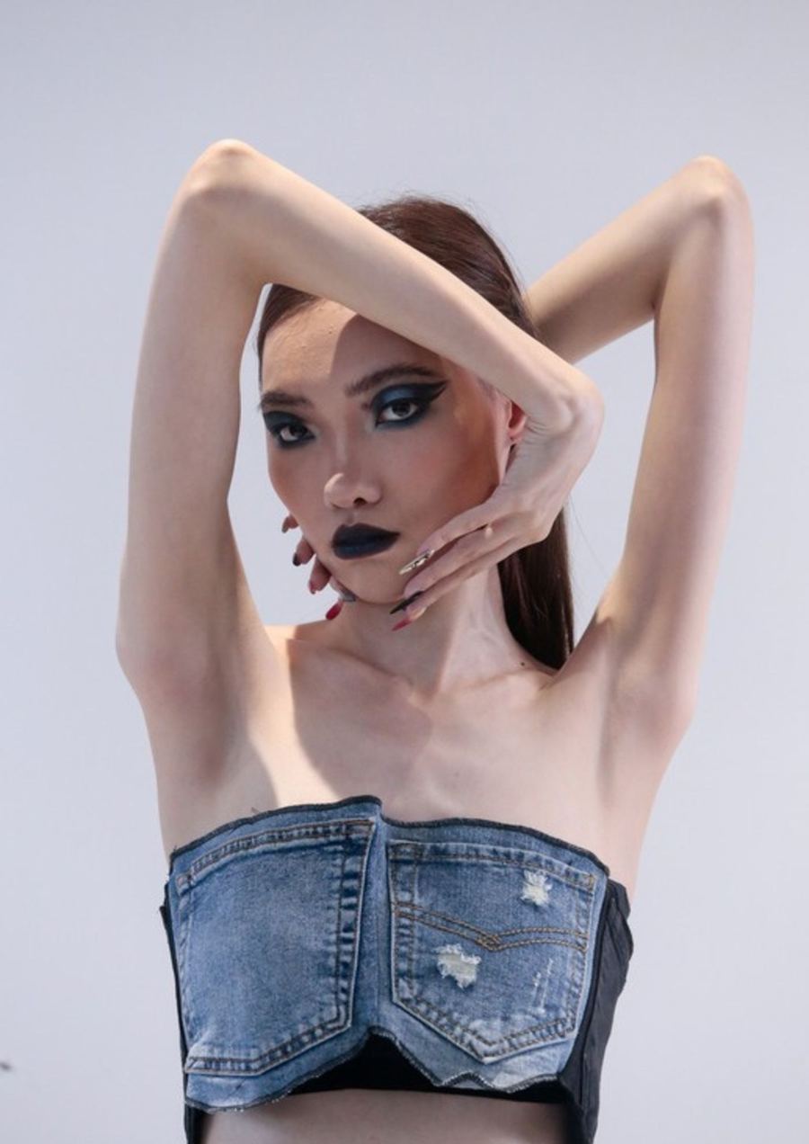 Denim bustier, arms framing the face