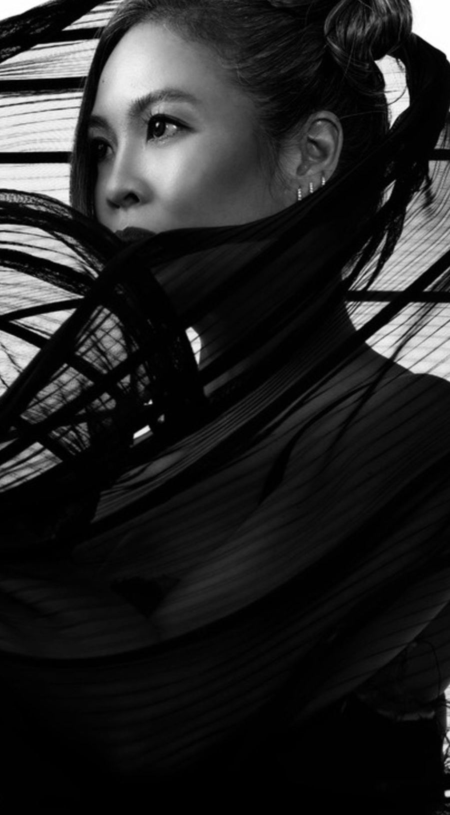 Portrait with black cords wrapped at the neck
